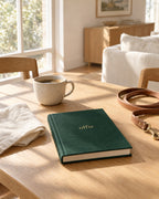 The Olfie Book in forest green on a kitchen table at home