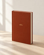 The Olfie Book in terracotta cloth with a gold foil wordmark