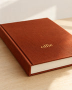 Close up of the terracotta cloth and gold foil on The Olfie Book